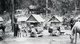 Thailand: A caravan of ethnic Haw traders and pack horses at a rest stop in Chiang Saen on the Thai-Lao border in 1902.