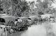 Cambodia: A caravan of oxcarts cross a ford in Cambodia in 1928.